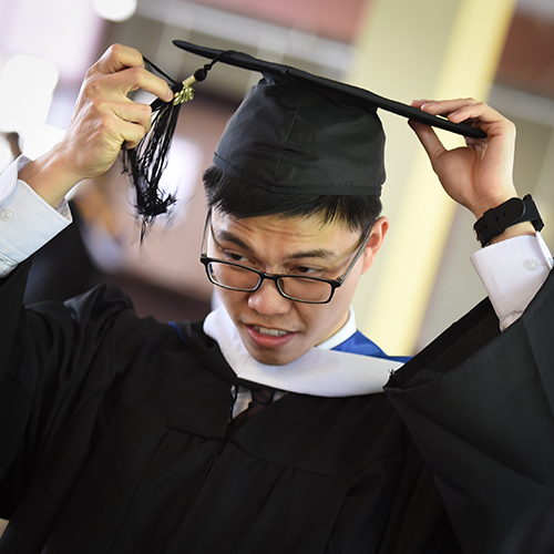 A student prepares for the ceremony.
